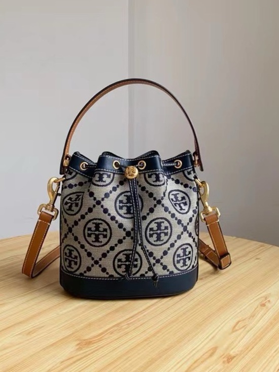 Tory Burch Handbags - Tory Burch Navy and Tan Logo Drawstring Bucket Bag